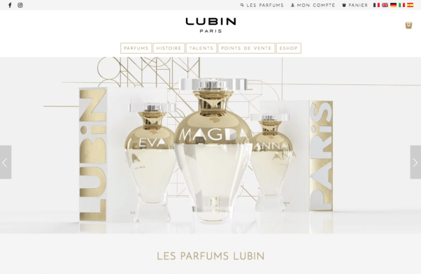 Les flacons de parfum Lubin Paris sont élégamment présentés sur un fond blanc minimaliste, incarnant la sophistication du design du studio. Limbus Studio