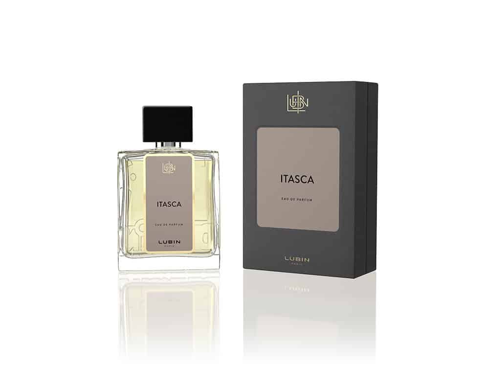 Un flacon de parfum Itasca avec un bouchon noir et une boîte d'emballage assortie reflète un design exquis. Limbus Studio